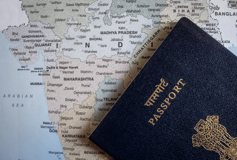 India passport on map of India.