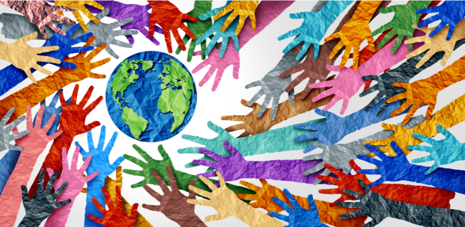 Colorful hands reaching towards globe.