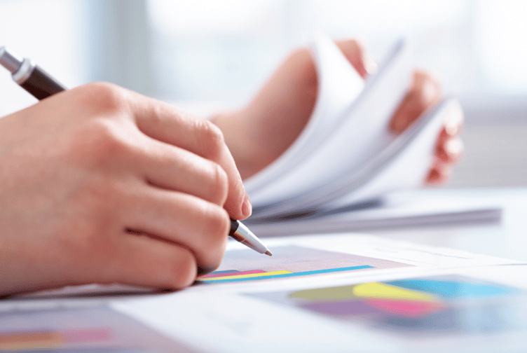 close up of financial papers and pen