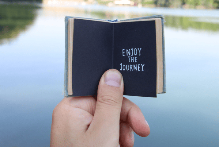 tiny book with "enjoy the journey"