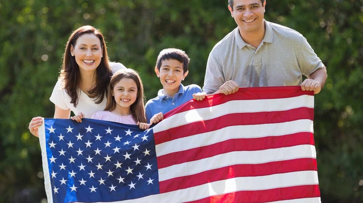 American family with an American flag