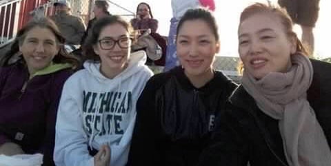 American mother and daughter with Korean mother and daughter