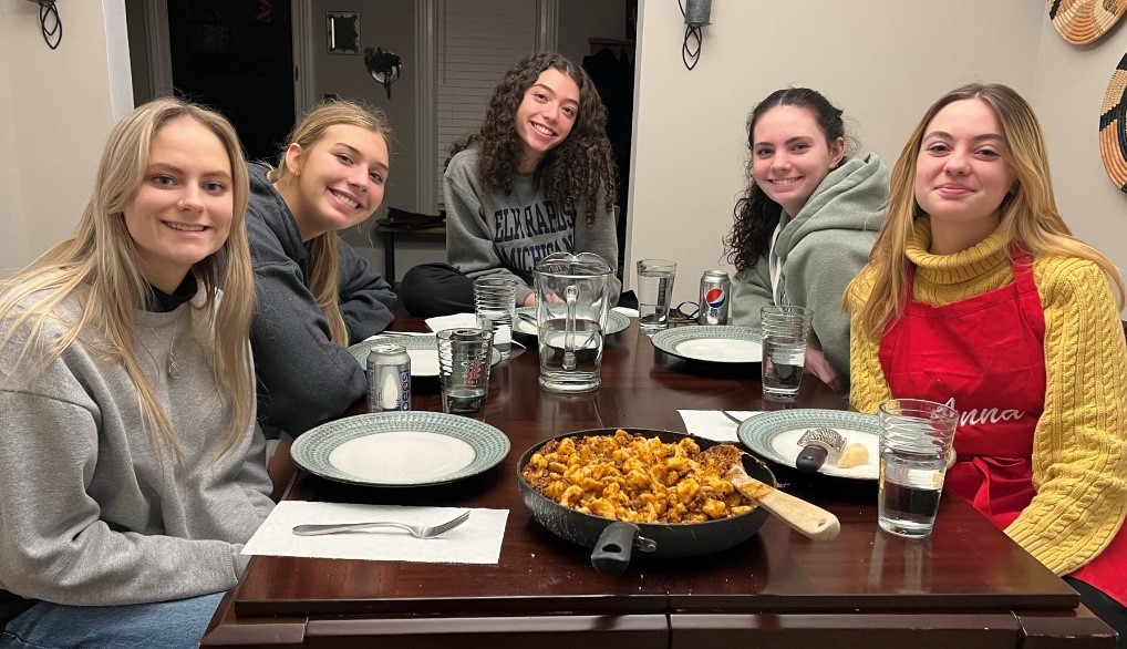 group of teen girls around dinner table