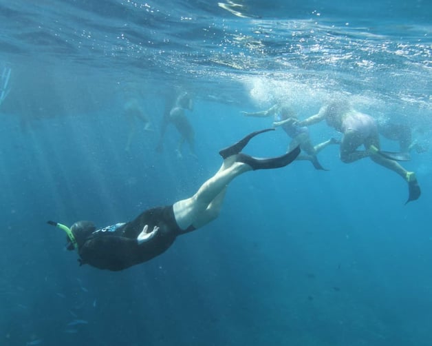 woman snorkeling underwater