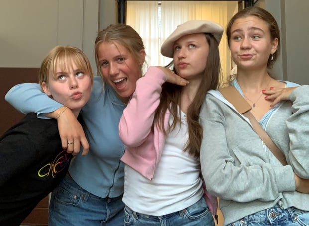 four teen girls making silly faces