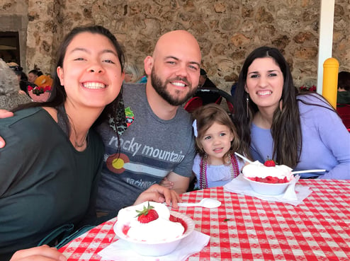 smiling family eating dessert