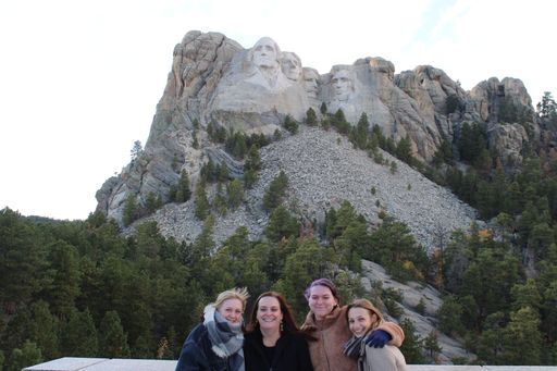 Cailin and host family in front of Mt. Rushmore