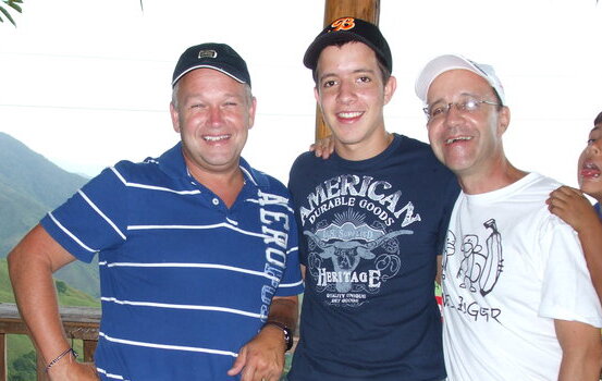American host dad with Colombian exchange student and his father in Colombia