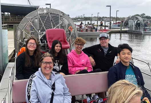 family in a boat in the Everglades