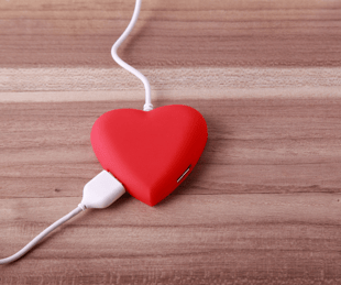 red heart with two cords plugged in