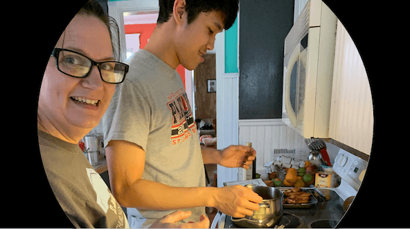 Student from Thailand cooking with host mom