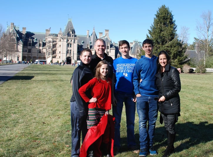 family standing in front of Biltmore Estate