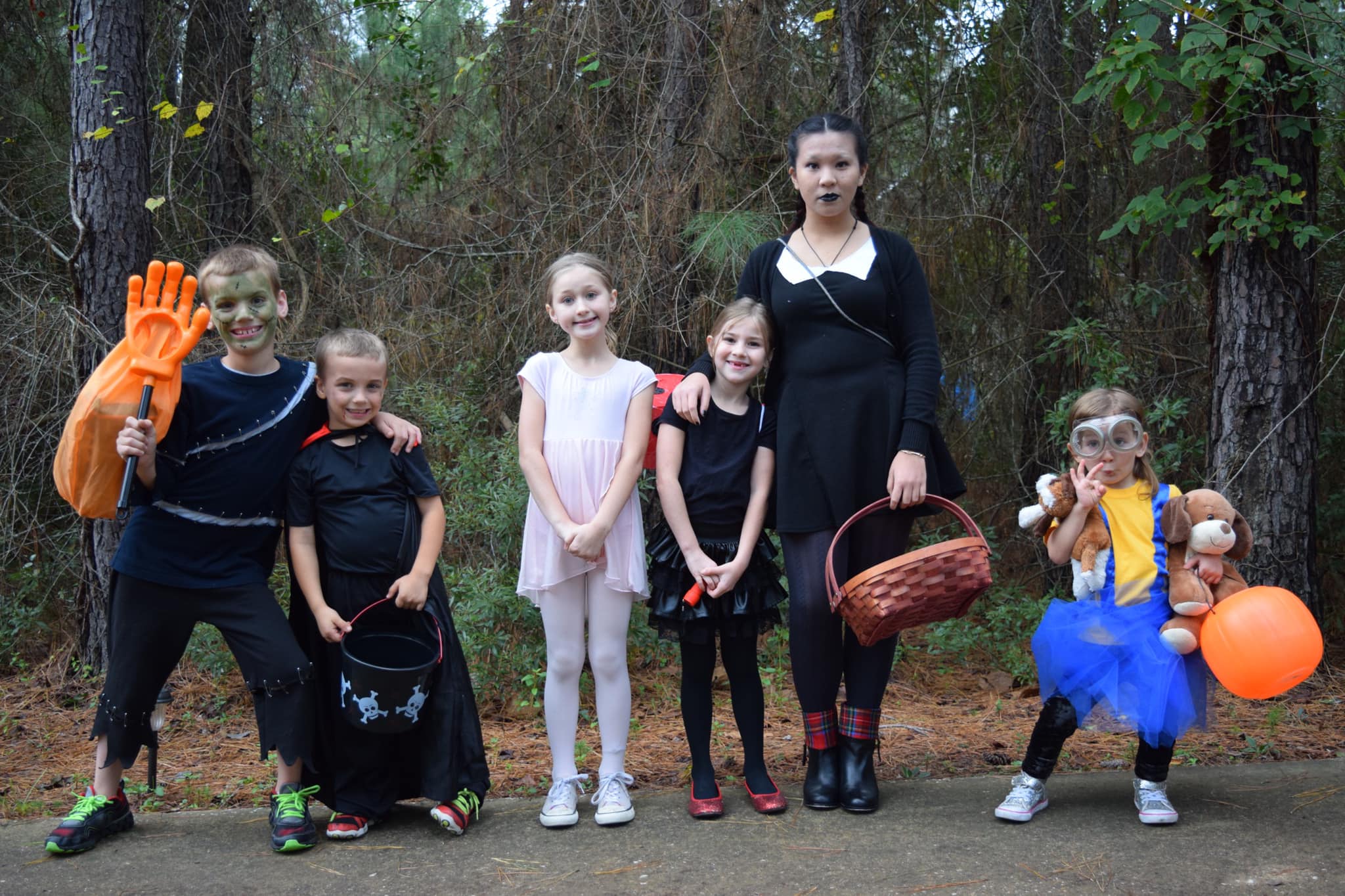 young kids and exchange student in Halloween costumes