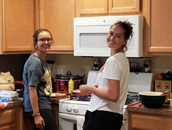 two teen girls cooking