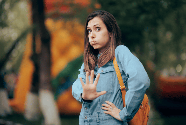 woman making "get back" hand signal