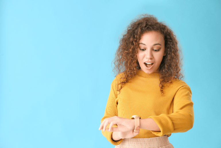 young woman checking watch