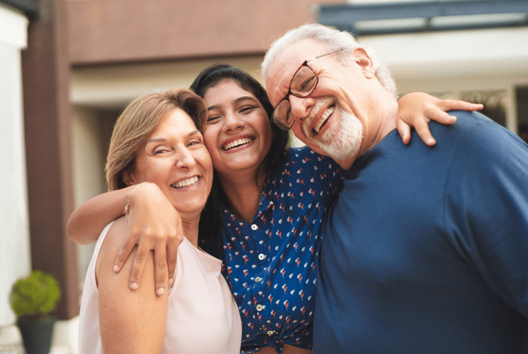 older couple and teen smiling