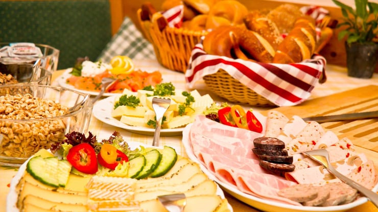 German cuisine including pretzels meats and cheeses