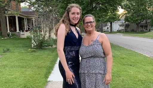 German teenager in prom dress with mom 