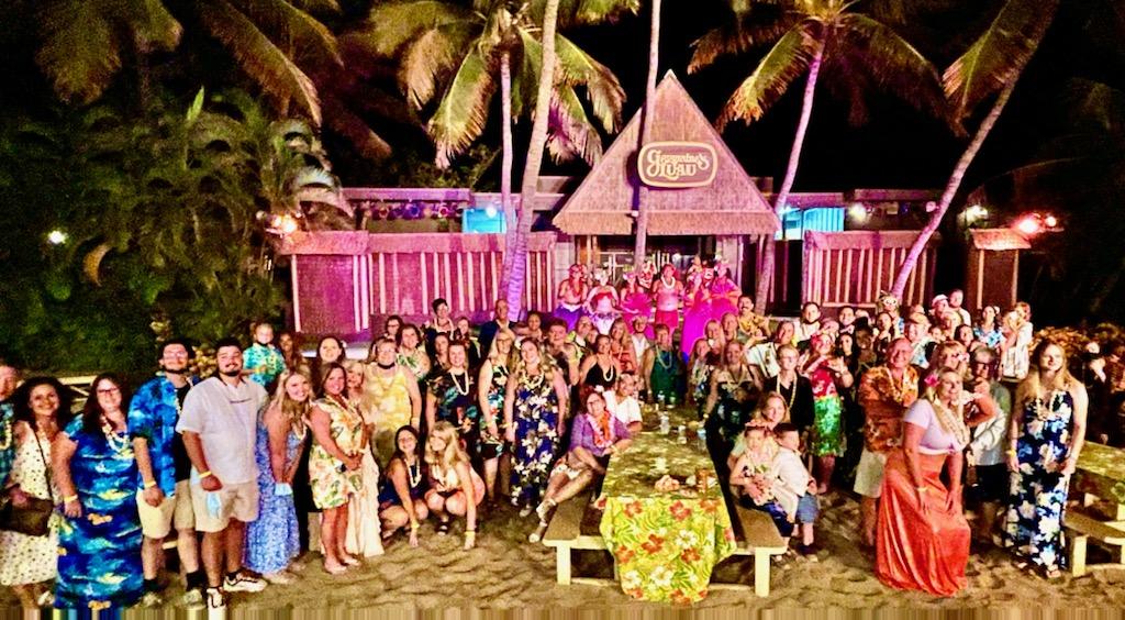 large group on beach at luau