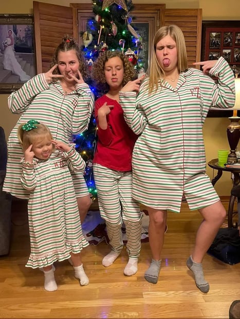 Family funny faces in PJ's at Christmas