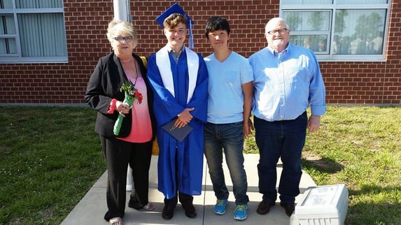 older couple and exchange students at graduation