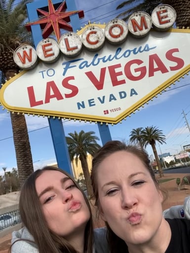 Ivona and host mom making duck lips in front of Vegas sign