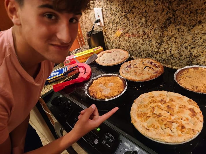 boy pointing at fresh baked apple pie