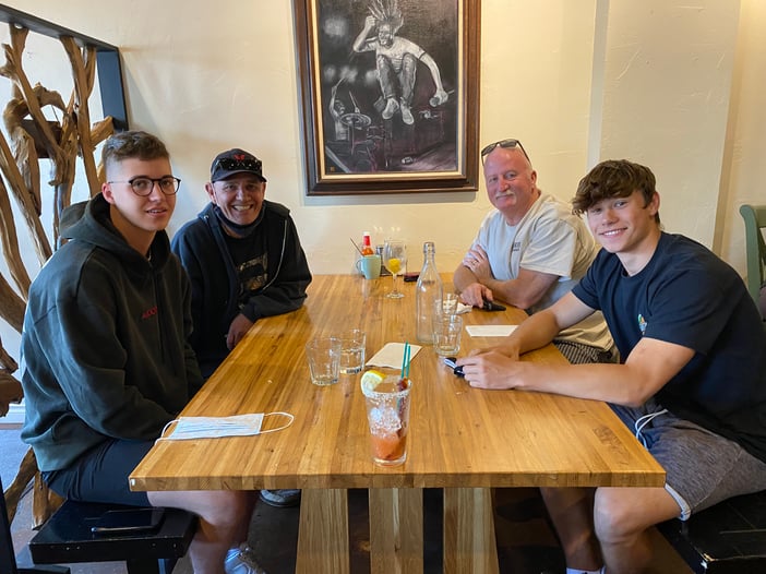 familiy seated at a restaurant booth