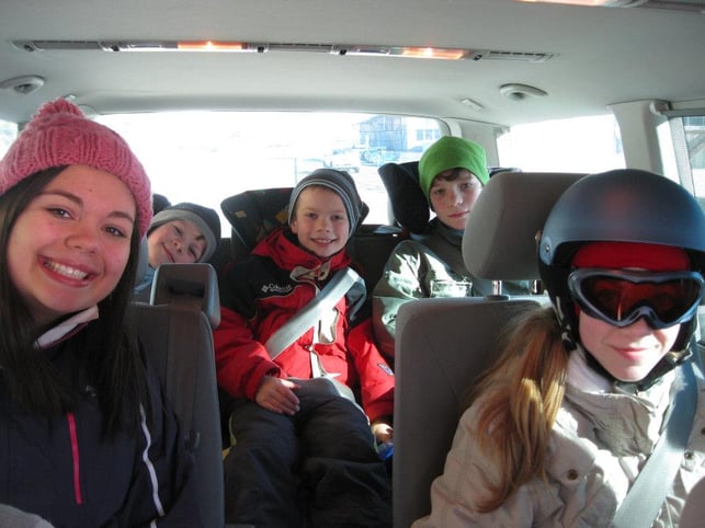 kids in car in winter clothes