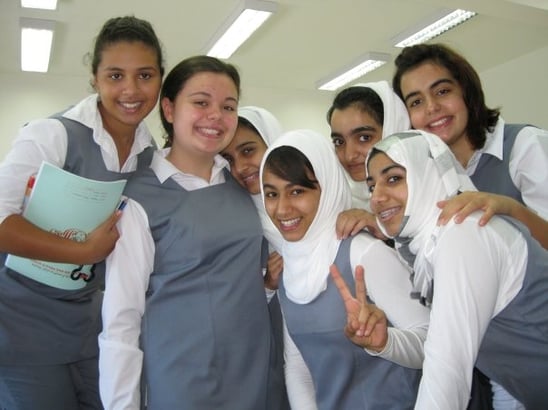 group of girls in gray school uniforms
