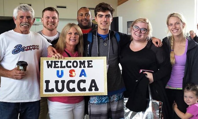 Extended family welcomes Lucca at airport