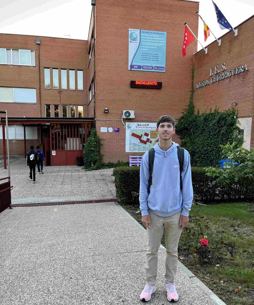 boy in front of Spanish school