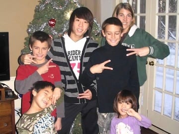 Korean exchange student with host family and Christmas tree
