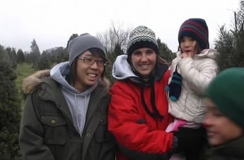 Korean exchange student with mother holding daughter in her arms