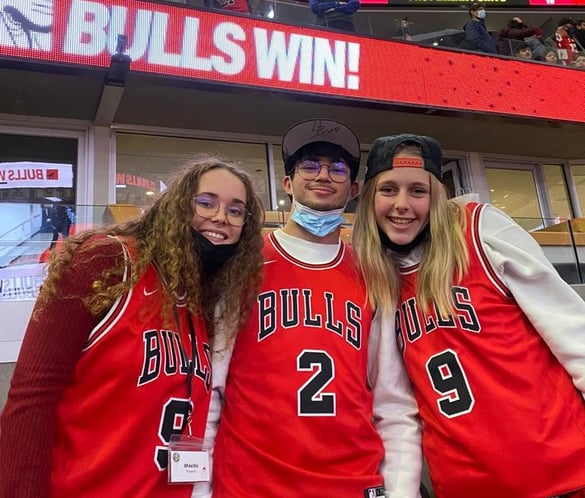 three teens at Chicago Bulls game