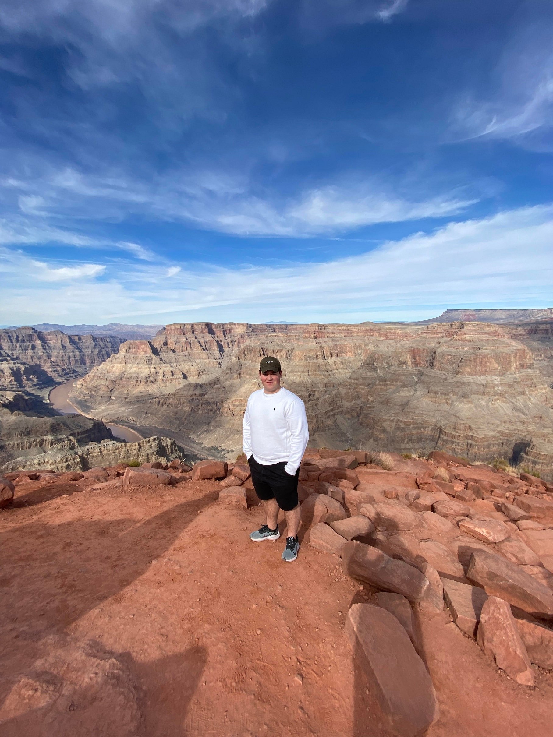 boy standing in front of Grand Canyon