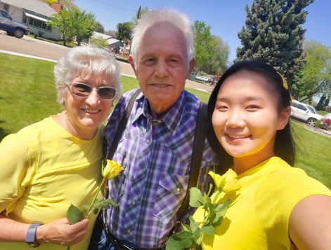 Asian girl taking selfie with senior couple