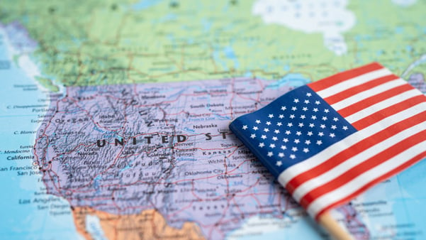 Map of the USA with a small American flag