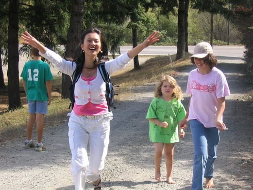 Korean girl smiling and running with arms up