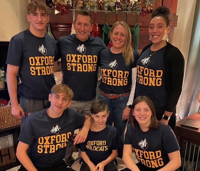 Family with matching Oxford Strong shirts