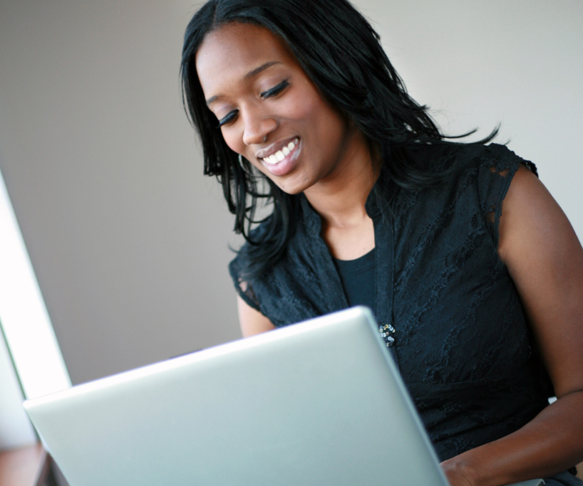 smiling woman on laptop