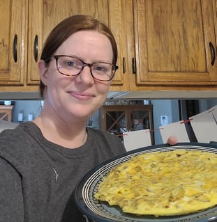 woman with Spanish omelette