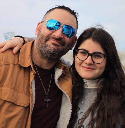 dad and teen girl, both smiling