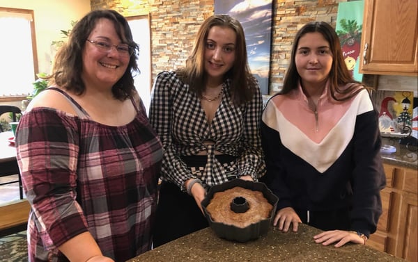 Mother and two daughters with German Apple Pumpkin Cake