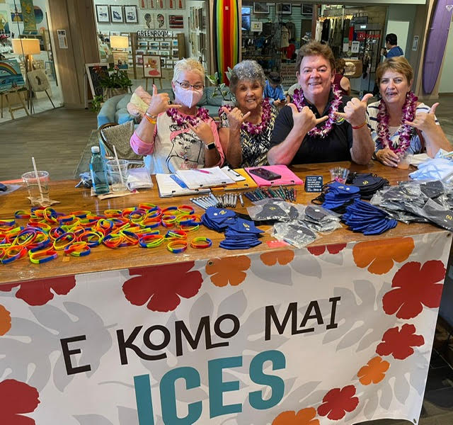 greeters at Hawaii welcome table