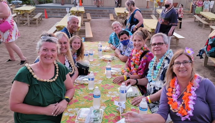 group wearing leis at luau