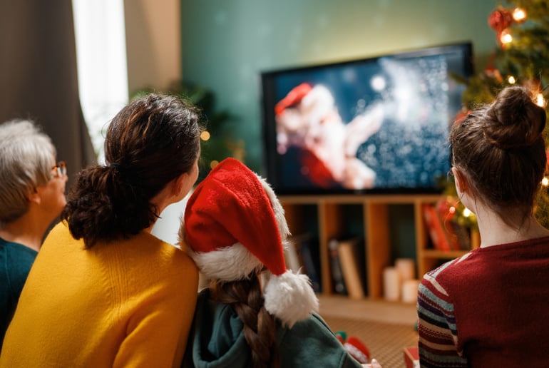 Family watching Christmas movie