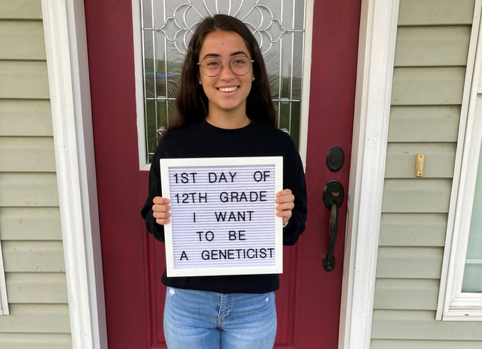 Paula holding first day of school sign