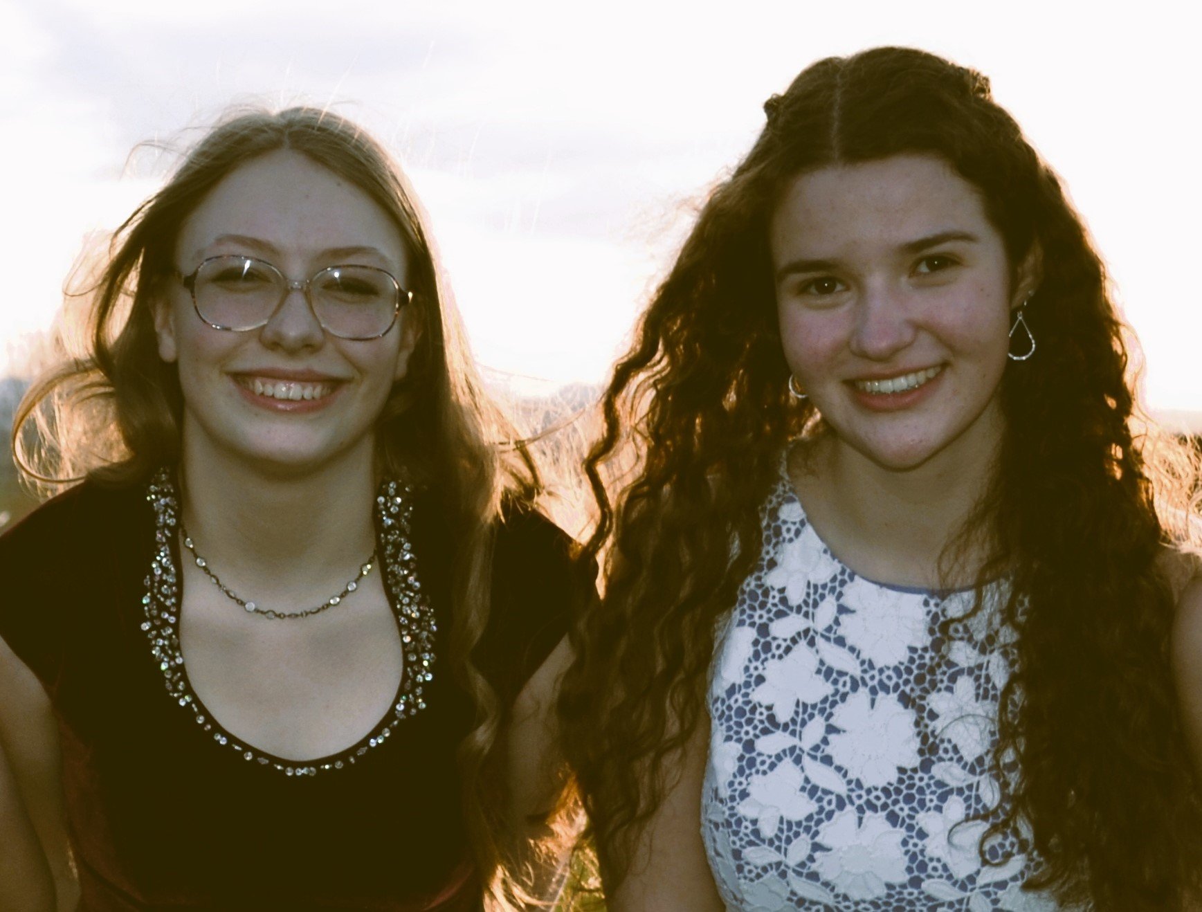 two teen girls smiling